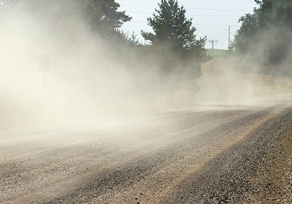 dust being released into the air on a dirt road